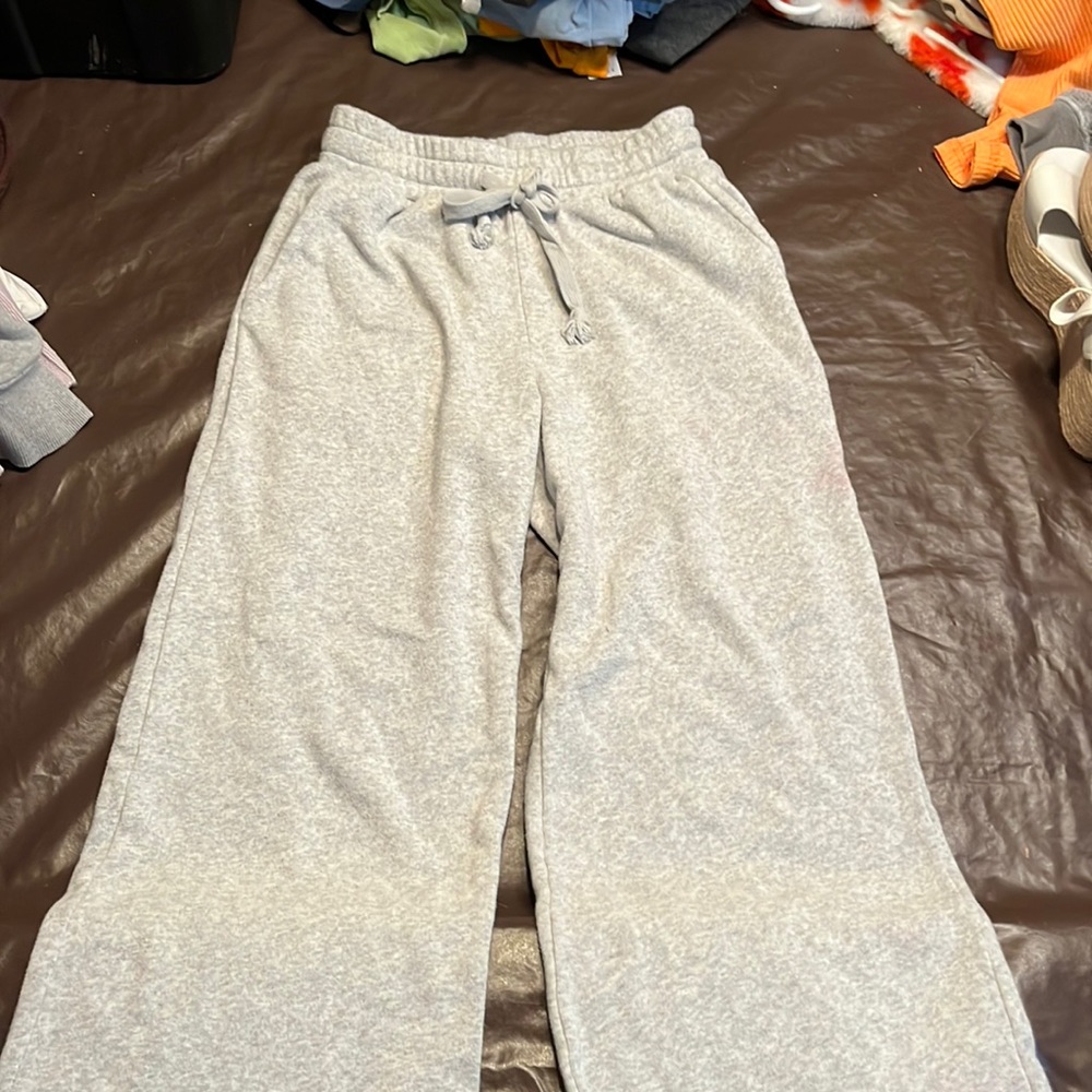 Grey sweatpants with a little flare at the end